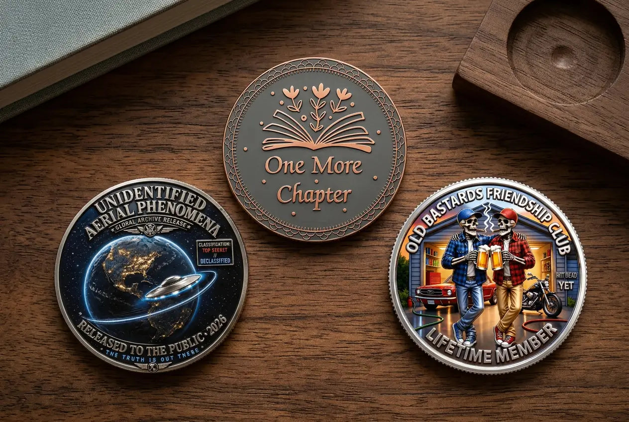 UFO Disclosure, One More Chapter and Old Bastards’ Friendship Club coins arranged on a wooden collector’s desk.