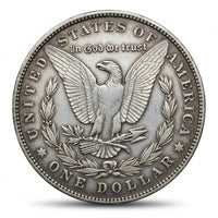Silver dollar coin with an eagle and 'In God We Trust' inscription on a white background
