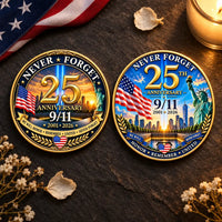 9/11 25th Anniversary Never Forget coin both variants overhead flat lay dark slate American flag ribbon white flower petals candlelight solemn memorial collectible