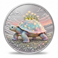 A round silver-toned coin featuring a pastel-colored tortoise standing in a flowered landscape with clouds and mountains in the background. The tortoise shell has a rainbow iridescent sheen, and small yellow flowers sit on its back.