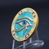 Eye of Horus ancient Egyptian commemorative collectible coin on display stand turquoise enamel gold relief scarab ankh border collectible token