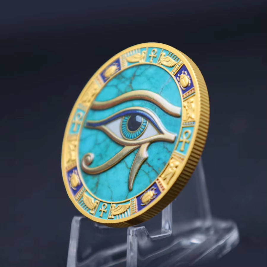 Eye of Horus ancient Egyptian commemorative collectible coin on display stand turquoise enamel gold relief scarab ankh border collectible token