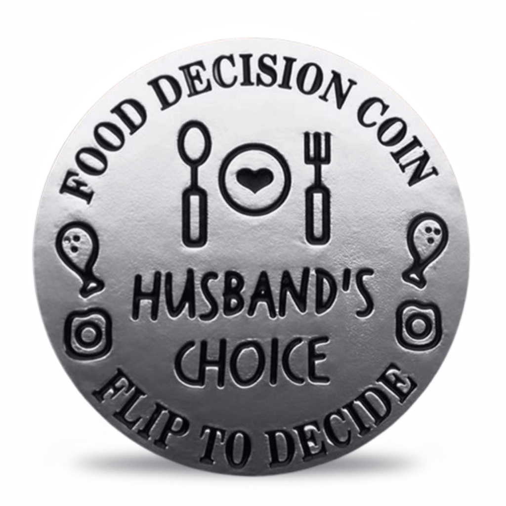 A round silver-toned coin-style token with engraved black text reading 'FOOD DECISION COIN' and 'HUSBAND'S CHOICE' plus 'FLIP TO DECIDE', surrounded by simple food and decision icons on a white background. Available at one more coin store