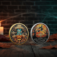 Two decorative Halloween-themed coins displayed on a rustic wooden surface with autumn leaves, a candle, and a dark brick wall background. One coin has a gold-toned rim and the other has a silver-toned rim, both featuring detailed fantasy artwork including pumpkins, bats, ghosts, and the text 'Happy Halloween'.