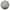 A round silver-toned religious medallion featuring the Bible verse Colossians 1:17, 'HE IS BEFORE ALL THINGS, AND IN HIM ALL THINGS HOLD TOGETHER,' with gold lettering, green leafy branches, and red floral accents.