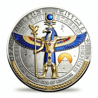 A circular collectible coin featuring an Egyptian Horus-God of Kingdom design, with a silver-toned background, gold and blue enamel details, and hieroglyphic inscriptions. Available at one more coin store.