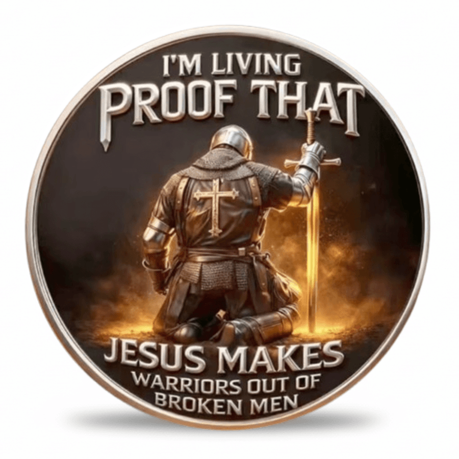 A circular metal coin featuring a kneeling armored warrior with a cross on the back holding a sword, with the text 'I'M LIVING PROOF THAT JESUS MAKES WARRIORS OUT OF BROKEN MEN' on a white background. Available at one more coin store