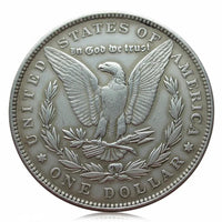 Morgan Dollar coin reverse showing eagle with spread wings, In God We Trust inscription, antique silver finish collectible
