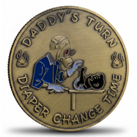 Bronze coin with a graphic of a father changing a baby's diaper and text 'Daddy's Turn Diaper Change Time'.