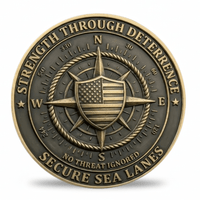 A round bronze-toned commemorative coin featuring a compass rose, shield with the American flag, and the text 'STRENGTH THROUGH DETERRENCE' and 'SECURE SEA LANES' on a white background.