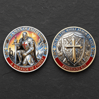 Two circular religious coins shown side by side on a dark textured background, displaying the front and back of a knight and shield design with text including 'A Man of Faith', 'A Warrior of Christ', 'Put on the whole armor of God', and 'Ephesians 6:11'.