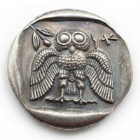 Ancient Greek Athena owl coin reverse side spread wings frontal pose large eyes Greek letters antique silver collectible coin
