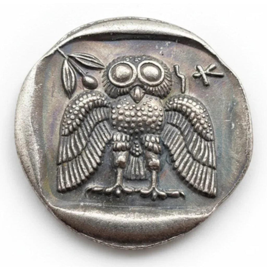 Ancient Greek Athena owl coin reverse side spread wings frontal pose large eyes Greek letters antique silver collectible coin

