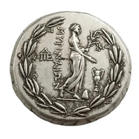 Ancient Greek Nike coin reverse side victory goddess laurel wreath temple symbols Greek inscription antique silver collectible coin
