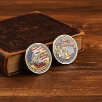 Bald Eagle 250 Years of Freedom USA collectible coin leaning against leather book on mahogany desk patriotic collector display gold-plated commemorative collectible token
