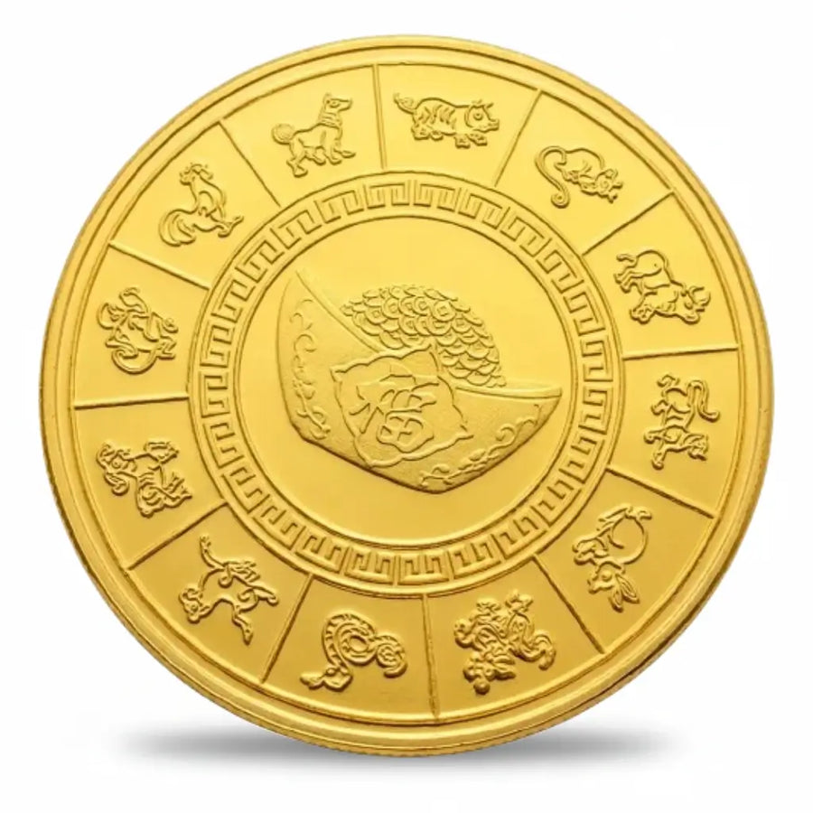 Gold-tone betta fish coin reverse with twelve Chinese zodiac animals in separate panels around the rim, enclosing a geometric patterned ring and a central ingot motif topped with a pile of coins, collectible token