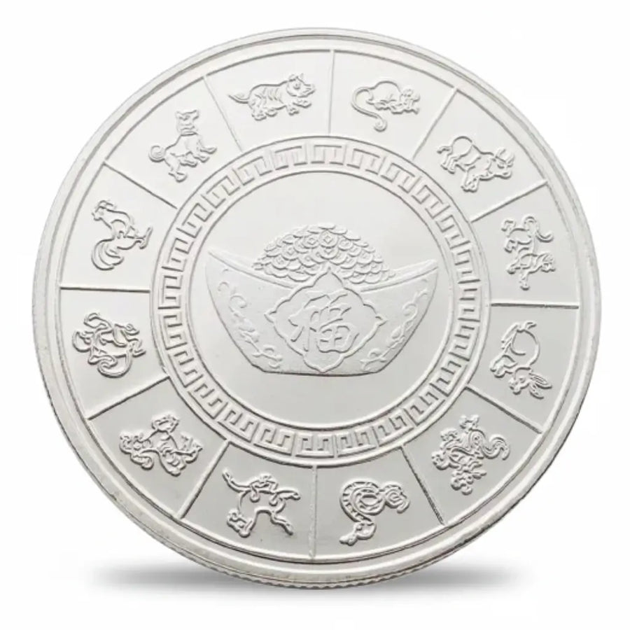 Silver-tone betta fish coin reverse showing twelve Chinese zodiac animals around the outer ring, with a geometric inner border surrounding an ingot motif and a pile of coins at the centre, collectible token

