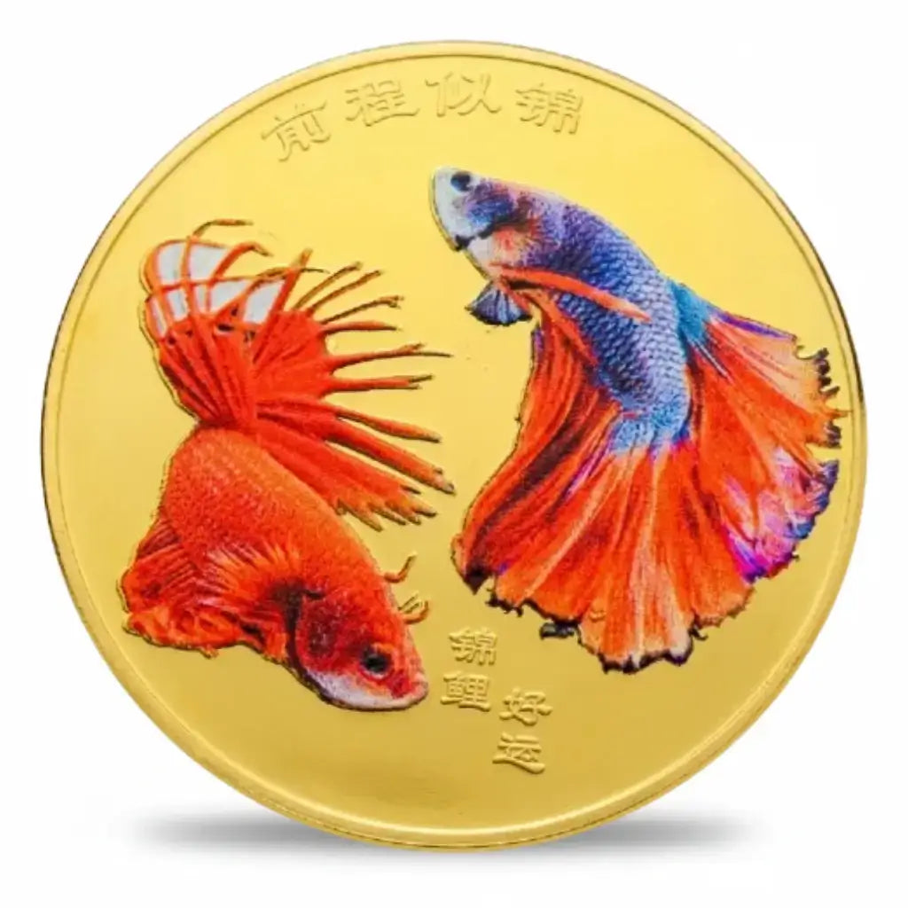 Gold-tone coin showing two Siamese fighting fish: a red betta with pointed, spreading fins and a blue-purple betta with a flowing orange-red tail. Chinese characters appear above and below the colourful fish artwork, available at One More Coin store