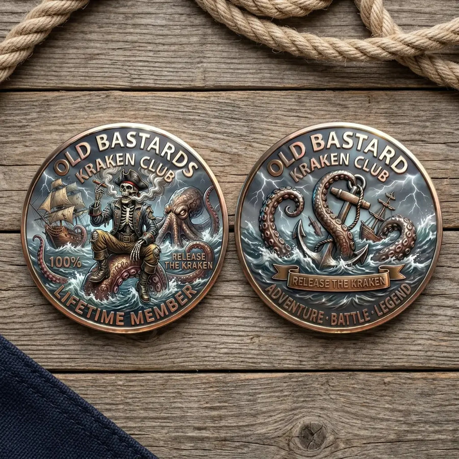 Overhead view of both Old Bastards Kraken Club coin faces side by side on weathered wooden boards, with nautical rope above and navy fabric in the corner. The left face shows a skeleton pirate seated on a Kraken tentacle beside a sailing ship; the right shows tentacles wrapped around an anchor amid stormy waves, with a “RELEASE THE KRAKEN” banner, collectible token
