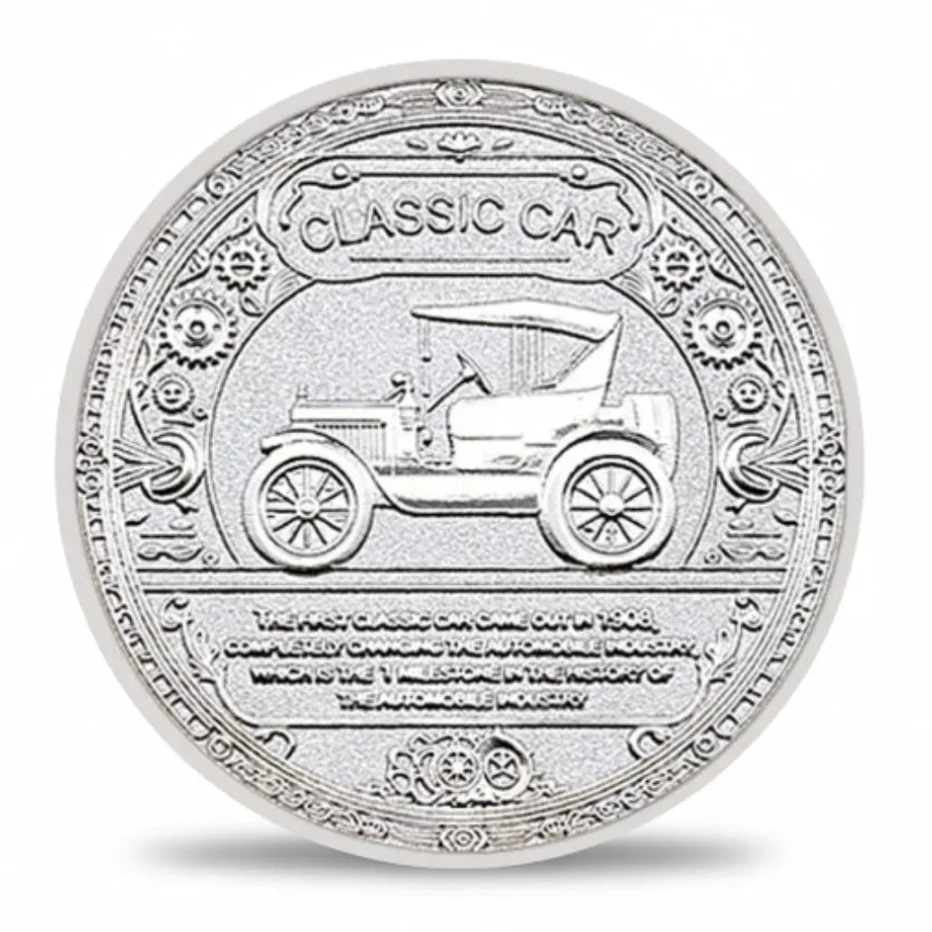 Silver coin with a design of a classic car and engraved text on a white background