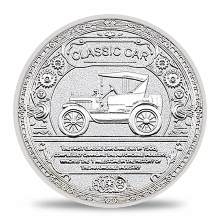Silver coin with a design of a classic car and engraved text on a white background