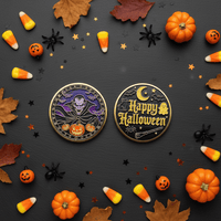 Two round Halloween-themed enamel pins displayed on a dark gray background, surrounded by autumn leaves, candy corn, mini pumpkins, black spider decorations, and star confetti. One pin features a purple skull and pumpkins, and the other features a gold 'Happy Halloween' design.