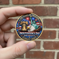 Hand holding Independence Day USA 250th anniversary collectible coin blue enamel gold rim patriotic commemorative collectible token lifestyle shot
