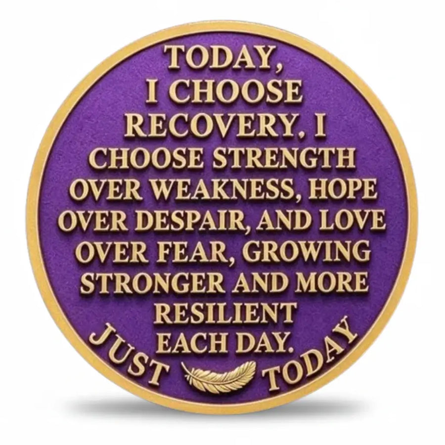 Recovery coin reverse with gold-tone lettering on a purple background, beginning “TODAY, I CHOOSE RECOVERY” and continuing with an affirmation about strength, hope, love and resilience. A gold-tone feather sits between “JUST” and “TODAY” along the lower border, collectible token