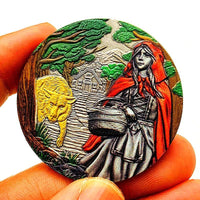 Little Red Riding Hood collectible coin held in hand showing colour detail scale and relief depth fairy tale collectible token
