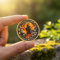 Hand holding Memento Mori Grim Reaper gothic collectible coin outdoors with natural bokeh background stoic collector display
