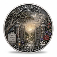 A round silver-toned commemorative coin featuring an engraved cemetery scene with an open gate, sun rays, flowers, a bird, and the text 'LIVE FULLY LOVE DEEPLY' and 'LEAVE NO REGRETS'.