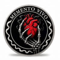 A round commemorative coin featuring a red anatomical heart held by skeletal hands on a black background, with the text 'MEMENTO VIVO' around the edge and a silver-toned outer border.