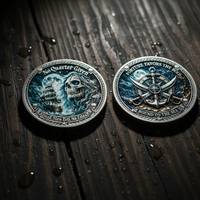 Two round pirate-themed challenge coins displayed on a dark wooden surface with water droplets. One coin shows a skull and ship with the text 'No Quarter Given' and 'Dead Men Tell No Tales'; the other shows crossed swords and a ship's wheel with 'Fate Favors the Bold' and 'Bound to the Sea'.