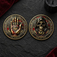 Two circular gothic metal coins displayed side by side on a dark textured stone surface. The left coin features a raised gold hand with an eye and the word 'YES', surrounded by red and gold ornamental details and the text 'YES RISING'.
