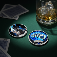 All In poker collectible coin set on green felt table with playing cards and whiskey glass