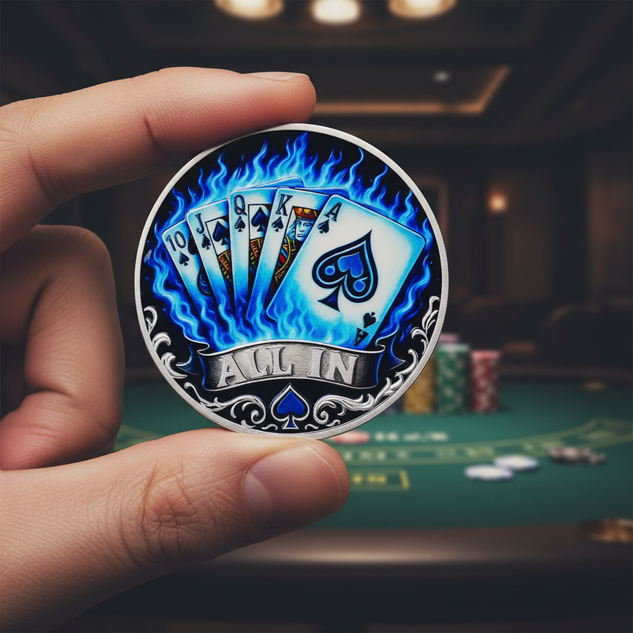 Hand holding All In royal flush poker collectible coin showing blue flame spades card design and silver scrollwork border
