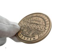 Russian One Million Roubles lucky gift coin held in white gloved hand showing obverse imperial crown 1000000 roubles antique bronze finish novelty collectible coin token
