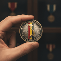 A hand holds a commemorative military coin featuring the text '58 479 FOREVER HONORED', '1975', and 'DUTY • SACRifice • BROTHERHOOD' around a central vertical tricolor stripe design in red, yellow, and green, with a gold-toned map-like emblem. The background is a dark, blurred display of other medals.