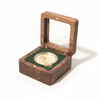 Walnut coin display box with forest green velvet interior holding a gold collectible coin on white background available at One More Coin store
