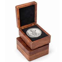 Wooden coin presentation box with black velvet interior displaying silver collectible coin available at One More Coin store

